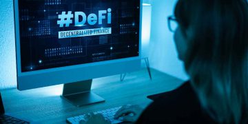 La scritta DeFi sullo schermo di un computer
