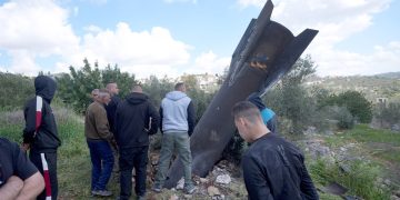 March 24, 2026, Nablus, Palestine Palestinian residents arrive to inspect the remains of an Iranian missile