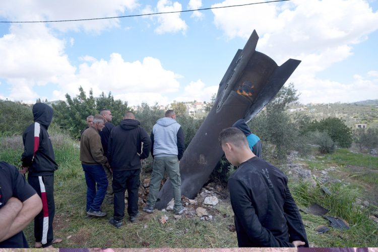 March 24, 2026, Nablus, Palestine Palestinian residents arrive to inspect the remains of an Iranian missile