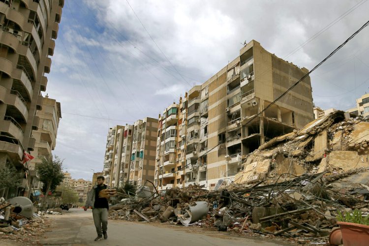 March 25, 2026, Beirut, Lebanon A resident of Beirut's southern suburb carrying bags of Manakish