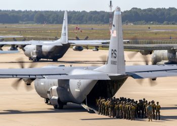 Paratroopers entering a US Air Force C-130 Hercules transport plane on Eindhoven airbase