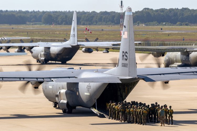 Paratroopers entering a US Air Force C-130 Hercules transport plane on Eindhoven airbase