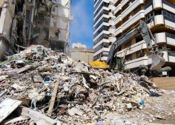 BEIRUT - APRIL 9, 2026 An excavator clears the debris after an Israeli airstrike