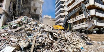 BEIRUT - APRIL 9, 2026 An excavator clears the debris after an Israeli airstrike