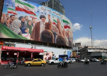 Iranians drive past a huge billboard carrying a picture of the late Iranian Supreme Leader Ayatollah Ali Khamenei in Tehran, Iran, 28 April 2026