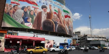 Iranians drive past a huge billboard carrying a picture of the late Iranian Supreme Leader Ayatollah Ali Khamenei in Tehran, Iran, 28 April 2026