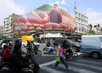 Iranians drive past a large billboard of Iranian Supreme Leader Ayatollah Mojtaba Khamenei on a street in Tehran, Iran, 20 April 2026