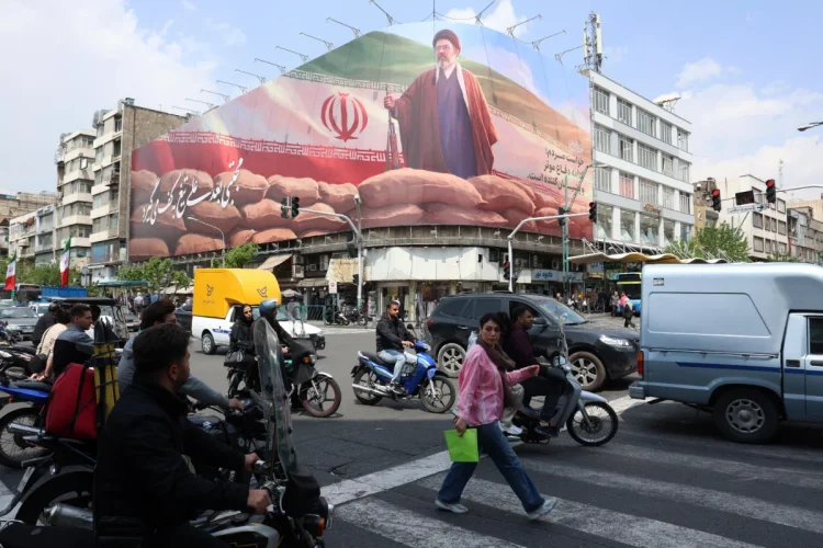 Iranians drive past a large billboard of Iranian Supreme Leader Ayatollah Mojtaba Khamenei on a street in Tehran, Iran, 20 April 2026