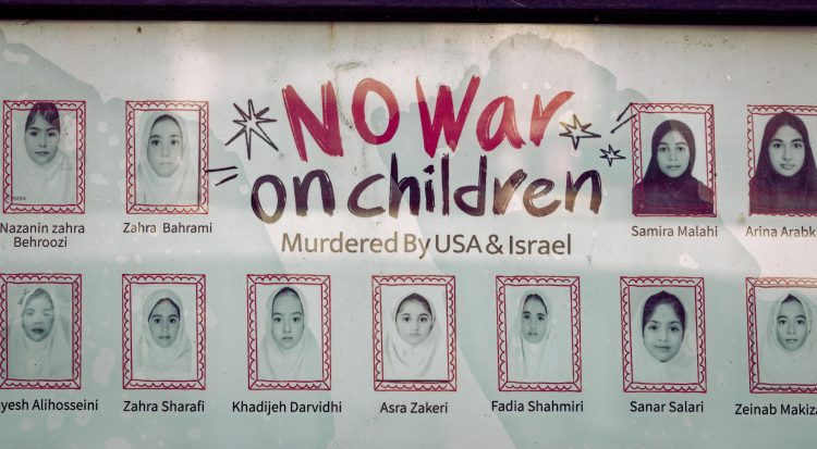 A poster with pictures of child war casualties on display on the wall of the Iranian consulate, in Shanghai, China, 30 April 2026