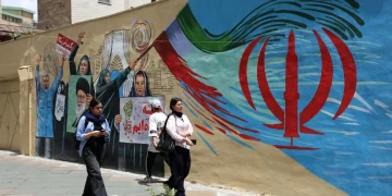 iranians-walk-next-to-a-anti-us-and-israel-mural-in-a-street-in-tehran-iran-08-m-1200x800.webp