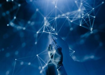Rappresentazione grafica dell’intelligenza artificiale con una mano robotica che interagisce con una rete digitale. L’immagine richiama lo sviluppo dell’IA e l'allarme acqua