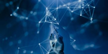Rappresentazione grafica dell’intelligenza artificiale con una mano robotica che interagisce con una rete digitale. L’immagine richiama lo sviluppo dell’IA e l'allarme acqua