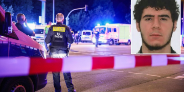 Ufficiale di polizia tedesco sorveglia scena, veicoli emergenza, foto sospettato. Berlino, attentatore al Pride ucciso dalla polizia: aveva legami con l'Isis