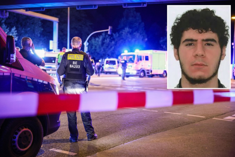 Ufficiale di polizia tedesco sorveglia scena, veicoli emergenza, foto sospettato. Berlino, attentatore al Pride ucciso dalla polizia: aveva legami con l'Isis