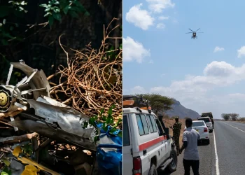 Rottami di elicottero schiantato e soccorritori con elicottero di salvataggio in Kenya.